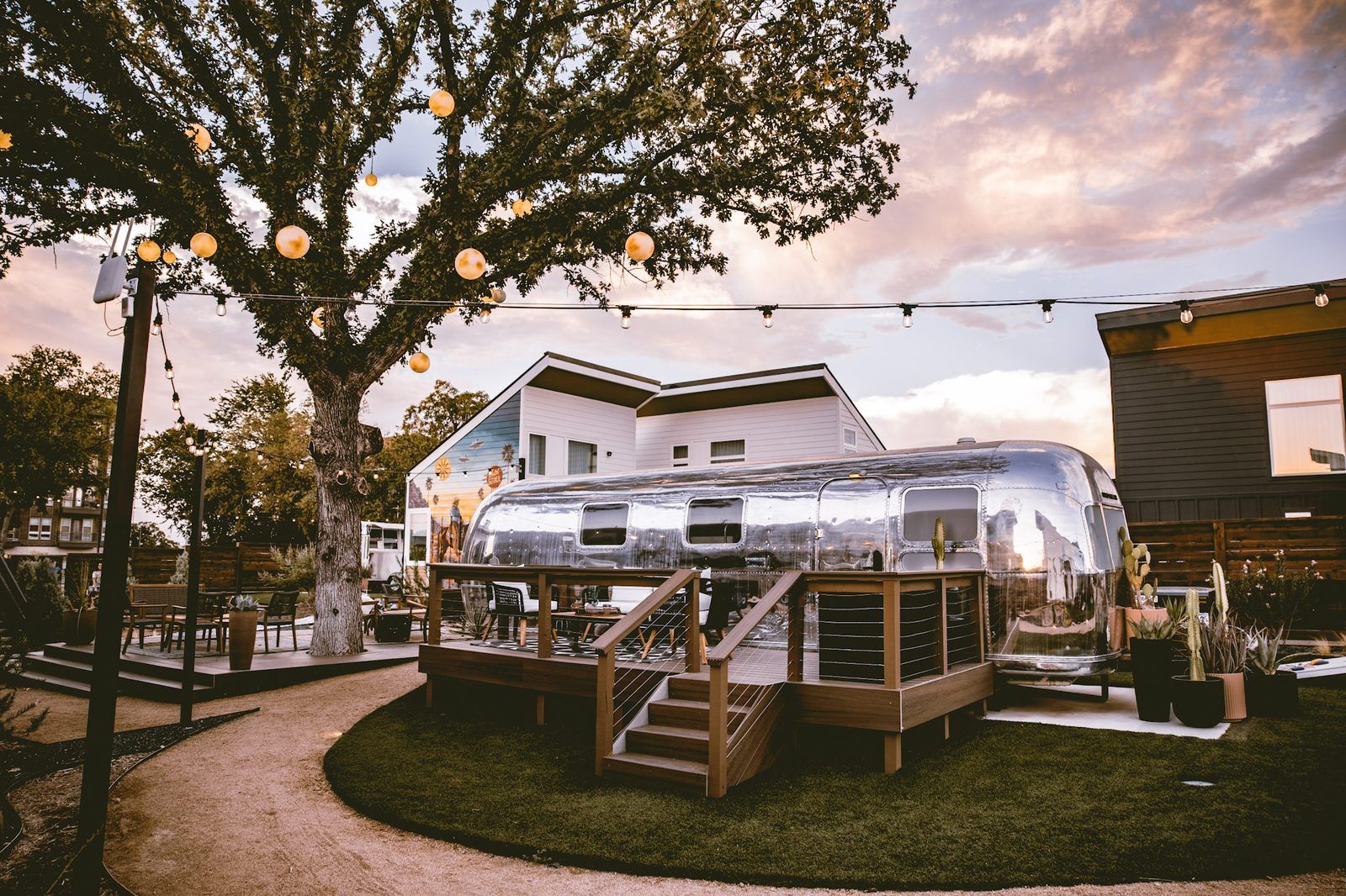 Custom Airstream suite exterior at twilight at Hotel SOMA in South Main Village, a short drive from TCU