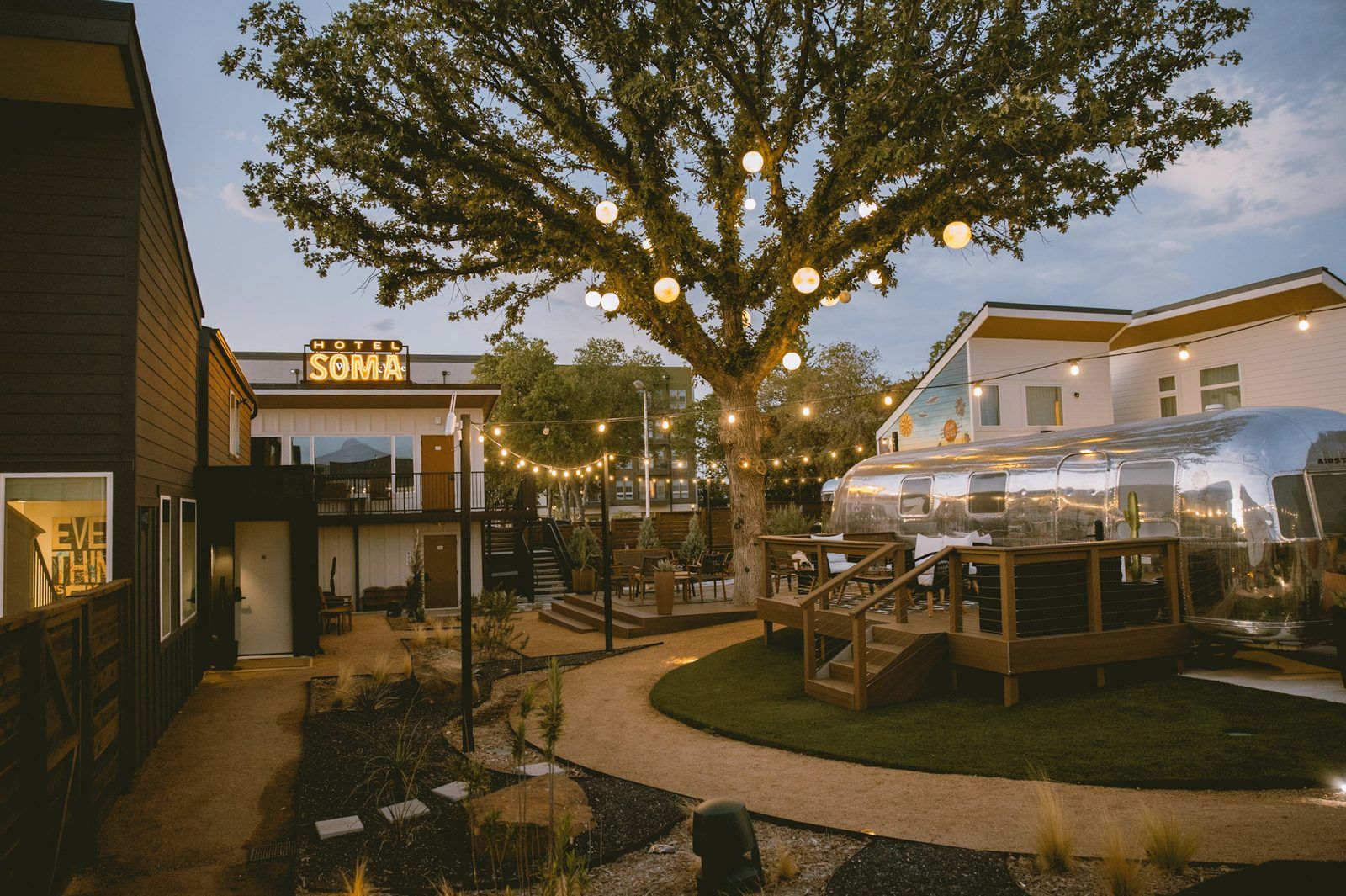 Quiet gated courtyard with fire pits at Hotel SOMA in South Main Village, Fort Worth