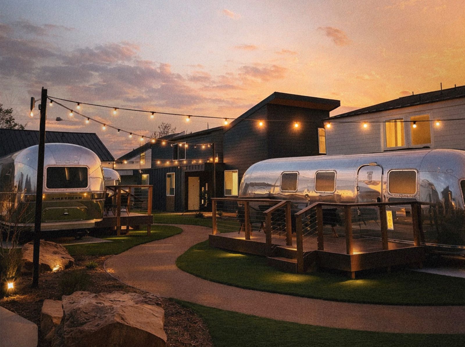 Hotel SOMA grounds with lawn paths, Airstream suites and casitas in Fort Worth