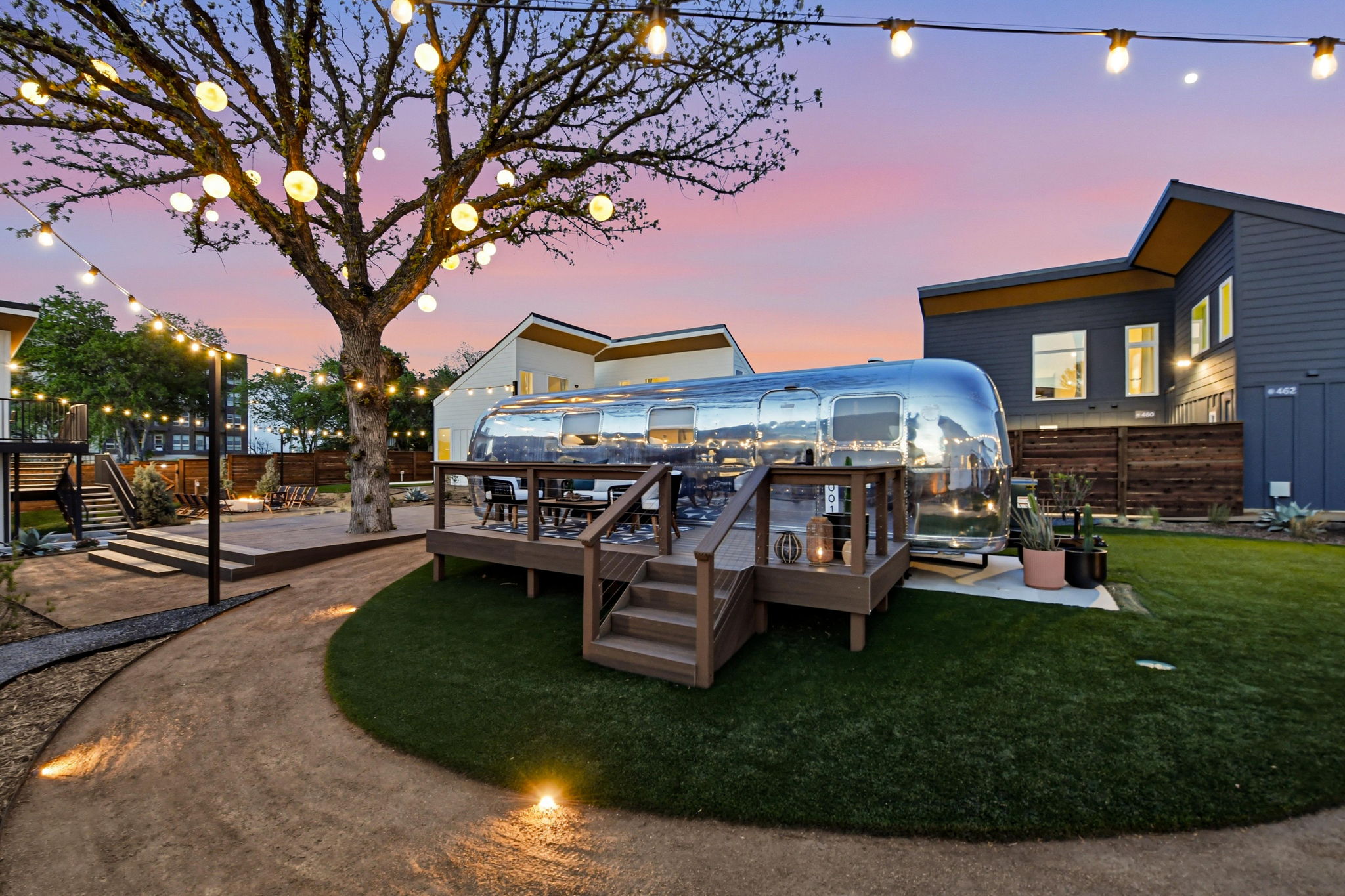 Custom Airstream suite exterior at twilight at Hotel SOMA in South Main Village, a short drive from TCU